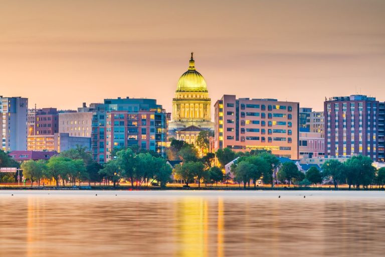 Madison, Wisconsin, USA downtown skyline at dusk on Lake Monona.