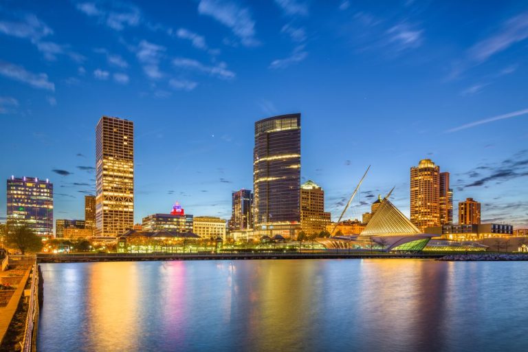 Milwaukee, Wisconsin, USA downtown city skyline on Lake Michigan at twilight.