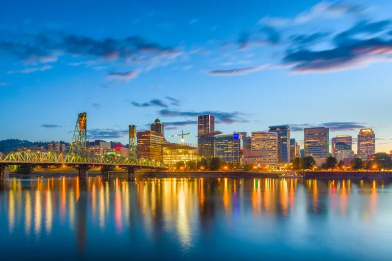 City Skyline Of Portland, Oregon Reflected Im The Water